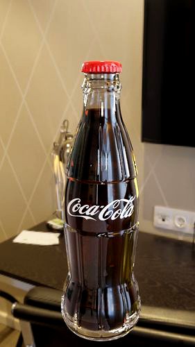 Coca cola bottle and glass