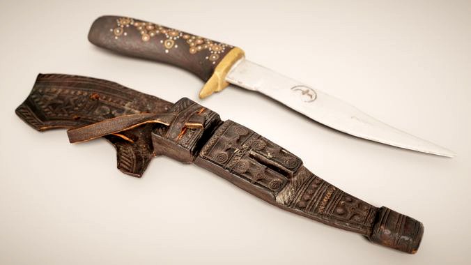 Black Decorated Knife and Brown Leather Pouch