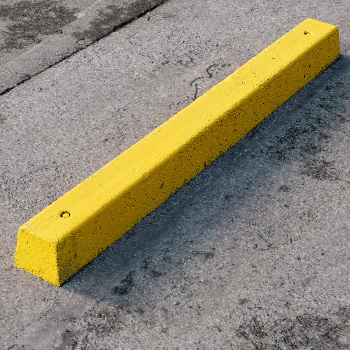 Yellow concrete parking stopper #01