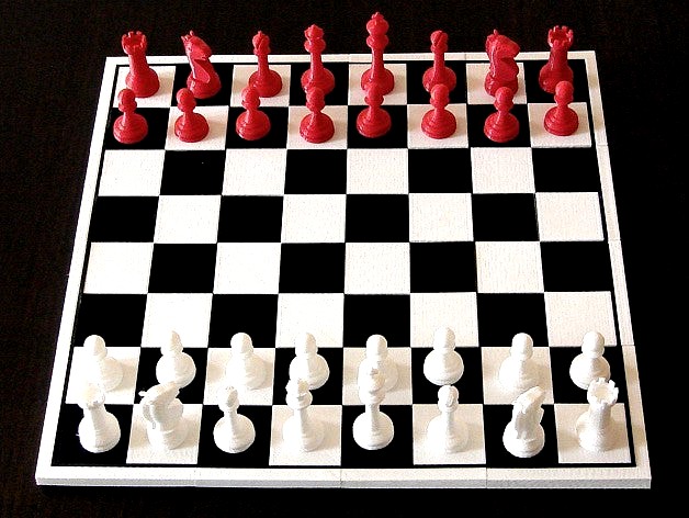 Chess pieces with board by Winslow
