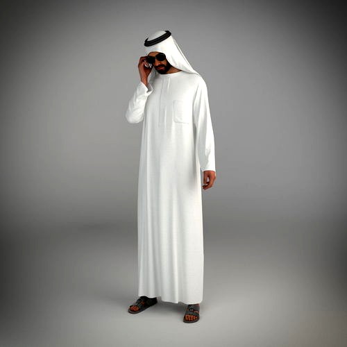 Traditional arab man from dubai posed talking on the phone