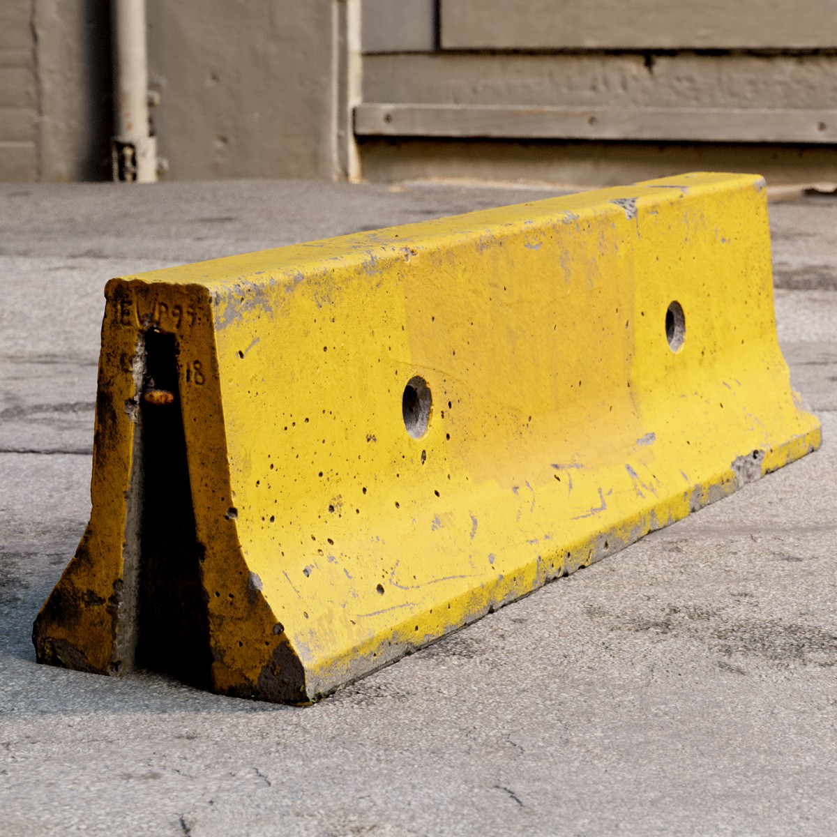 Yellow weathered concrete parking block