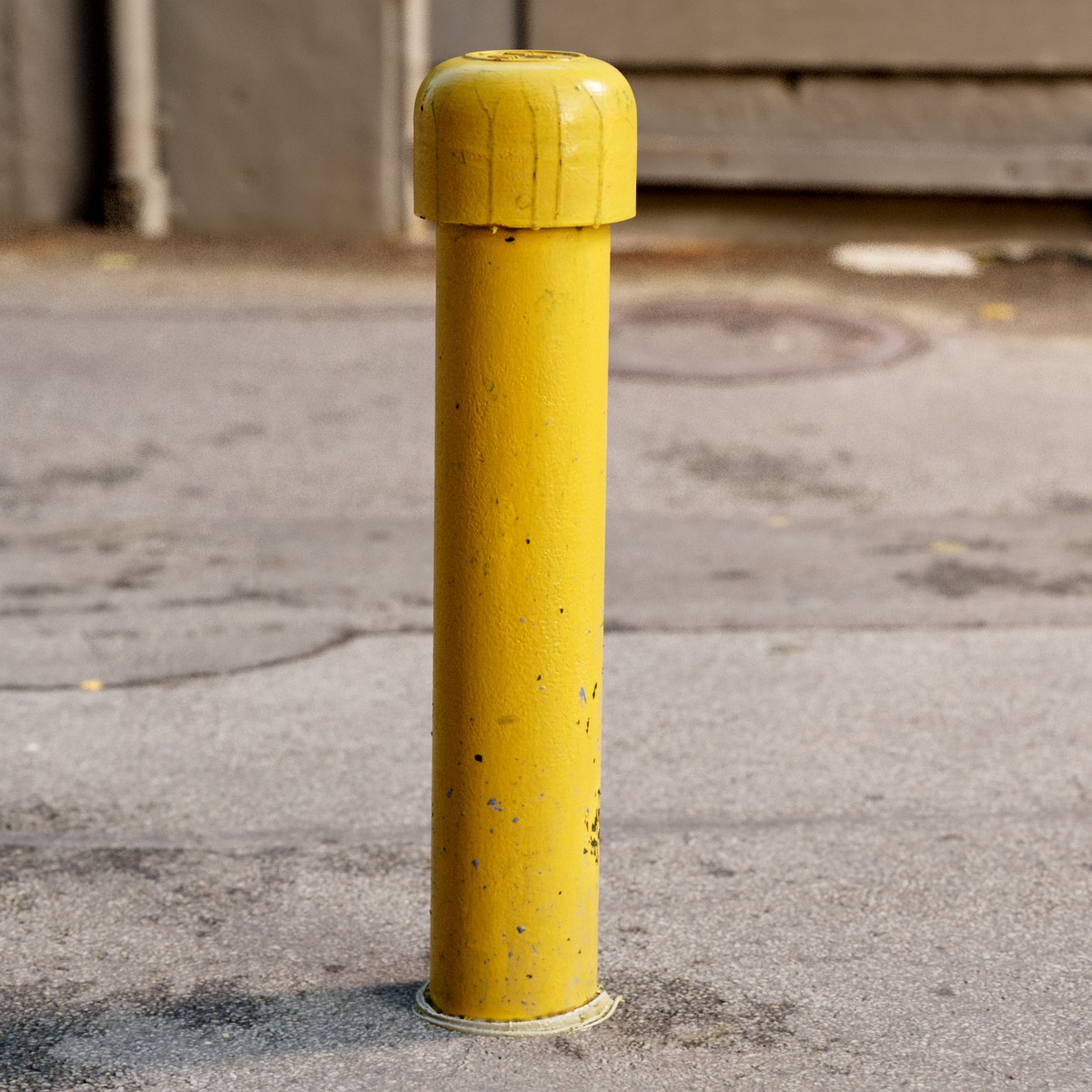 Yellow freshly painted parking post (bollard)