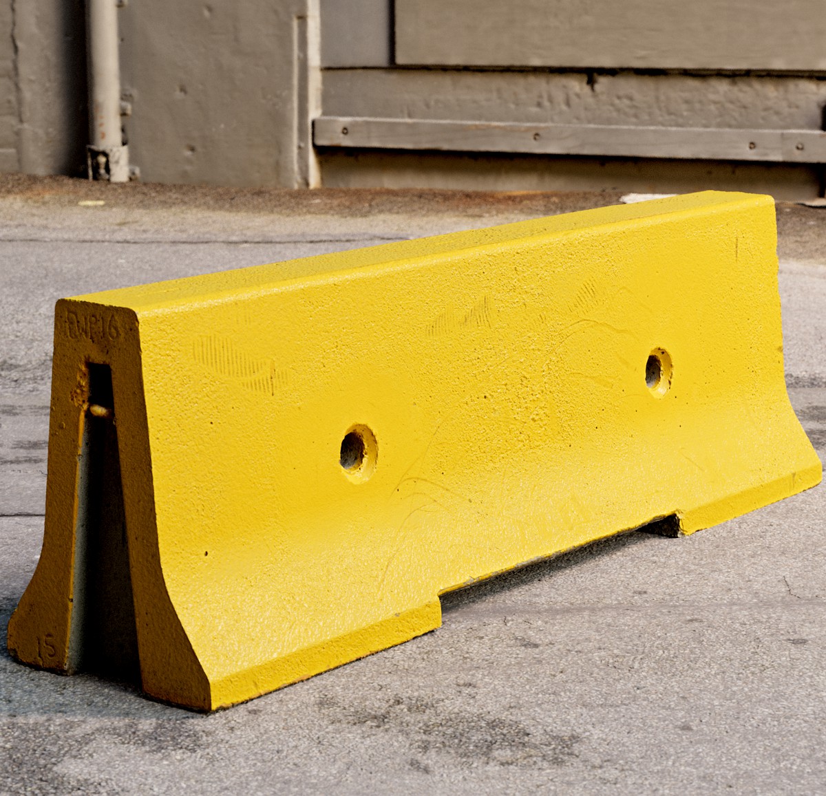 Yellow concrete parking block