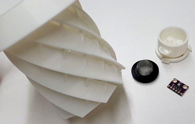 Helical rain/radiation shield for weather sensors with sensor mounting