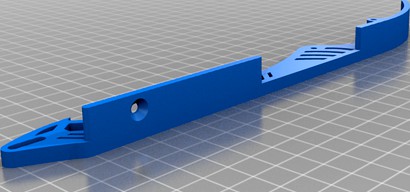Spring-loaded track tensioner