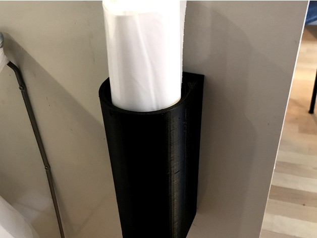 Holder for a roll of garbage bags