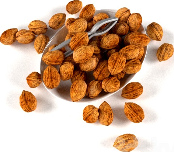 nuts in a bowl with nutcracker