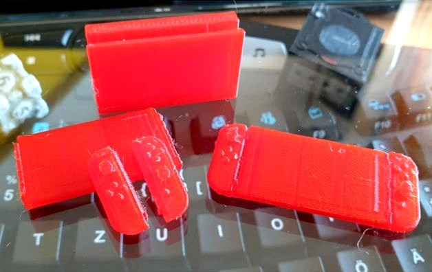 Tiny Nintendo Switch with detachable Joy-Cons, kickstand and dock by IXPatch