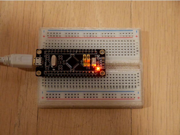 Split breadboard holder by arpruss