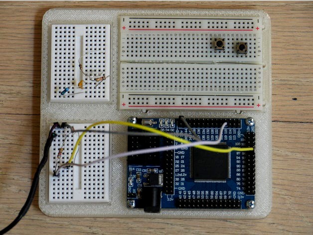 Cyclone II FPGA minimal development system and breadboard holder by arpruss