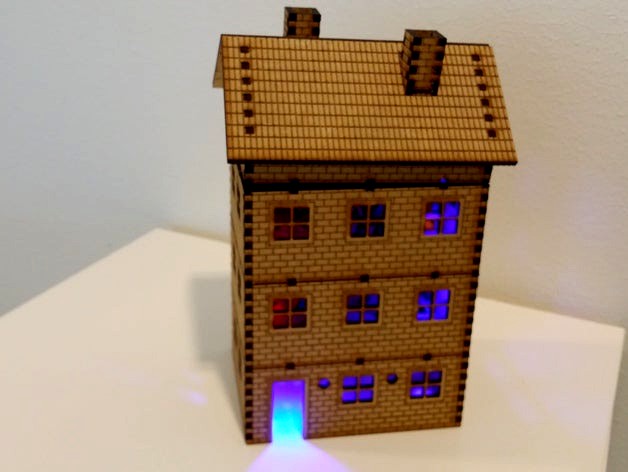 LED lighted lasercut multi storey brick house by Yngel