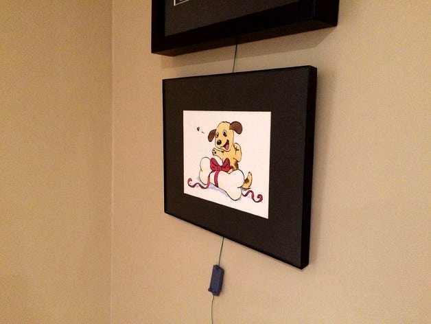 Wire-threaded picture frame wall hanger by 3E8