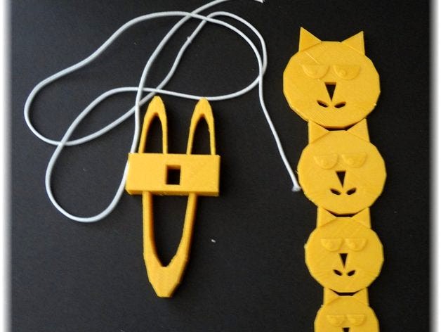 Knitting fork, own fantasy design combined with a cat button by heartphone