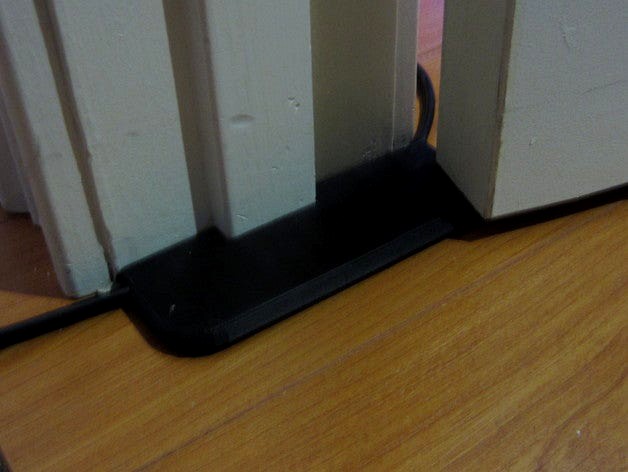 Extension cord under-door pass-thru protector  by toybuilder