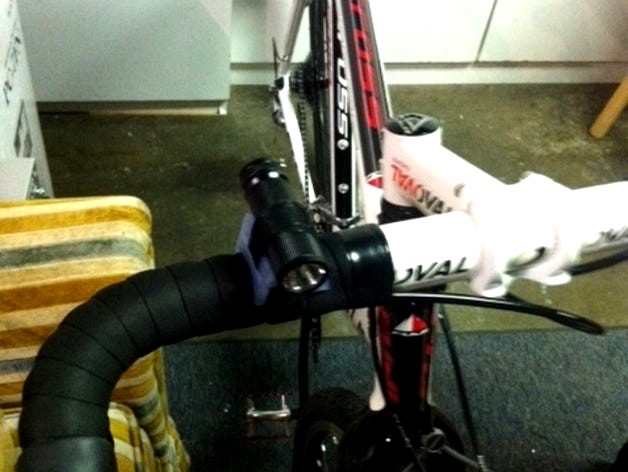 Flashlight adapter for bicycle handlebars by koolatron