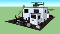 small movie set with vihicles behind