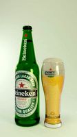 heineken beer bottle and glass of beer