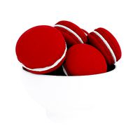 Red macaroons in bowl