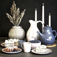 A set of dishes with cake muffins and dried flowers