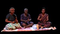 Aboriginal Women Sitting On Rug