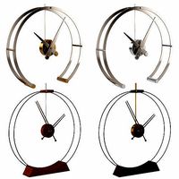 Nomon Aire and Omega table clocks