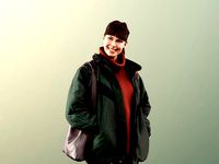 Alyssa 11522 - Young Woman Standing And Smiling With Bag