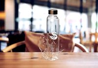 Glass water bottle with water splash 3d product design