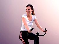 Nadin 11138 - Young Woman Training On A Bike In Gym