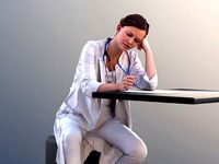 Nadin 10466 - Female Doctor Sitting And Writing