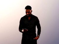 Danny 11737 - Standing Black Man Checking His Phone