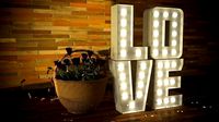 LOVE letters with lamps and a busket with roses