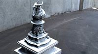 Lizardman statue bust in ornate model stand