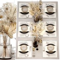Table setting for 6 persons with a bouquet of dried flowers