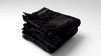 Pile or stock of folded black jeans pants for wardrobe