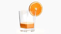 orange juice and straw in a rocks glass