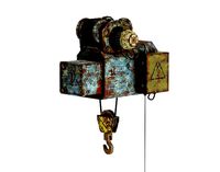 Old rusted electric hoist telpher