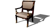 FAUTEUIL D'UN SALON EN ACAJOU À MOTIFS D'INSPIRATION 'RETOUR D'ÉGYPTE'