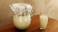 Glass jug and glass with milk (112990)