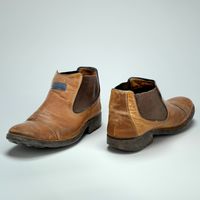 Brown mens leather shoe worn