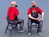 Photorealistic Bald Worker in Overalls and Red T-shirt Sitting