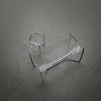 Transparent table and chair with metal inserts