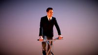 Elegant Business Man Virtue Riding a Bike