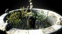 Old overgrown fountain with statues