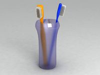 Glass with toothbrushes