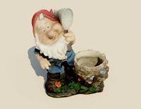 Gnome with flower pot statue