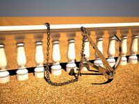 Anchor with chain near balustrade