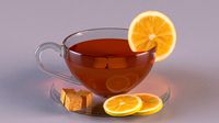 Cup of tea with cane sugar and lemon