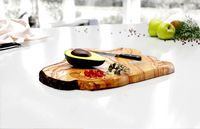 Wooden cutting board with avocado