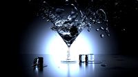 Glass and water and ice on black lighting background